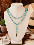 Turquoise beaded necklace with a rustic feather charm. 🩵🤎