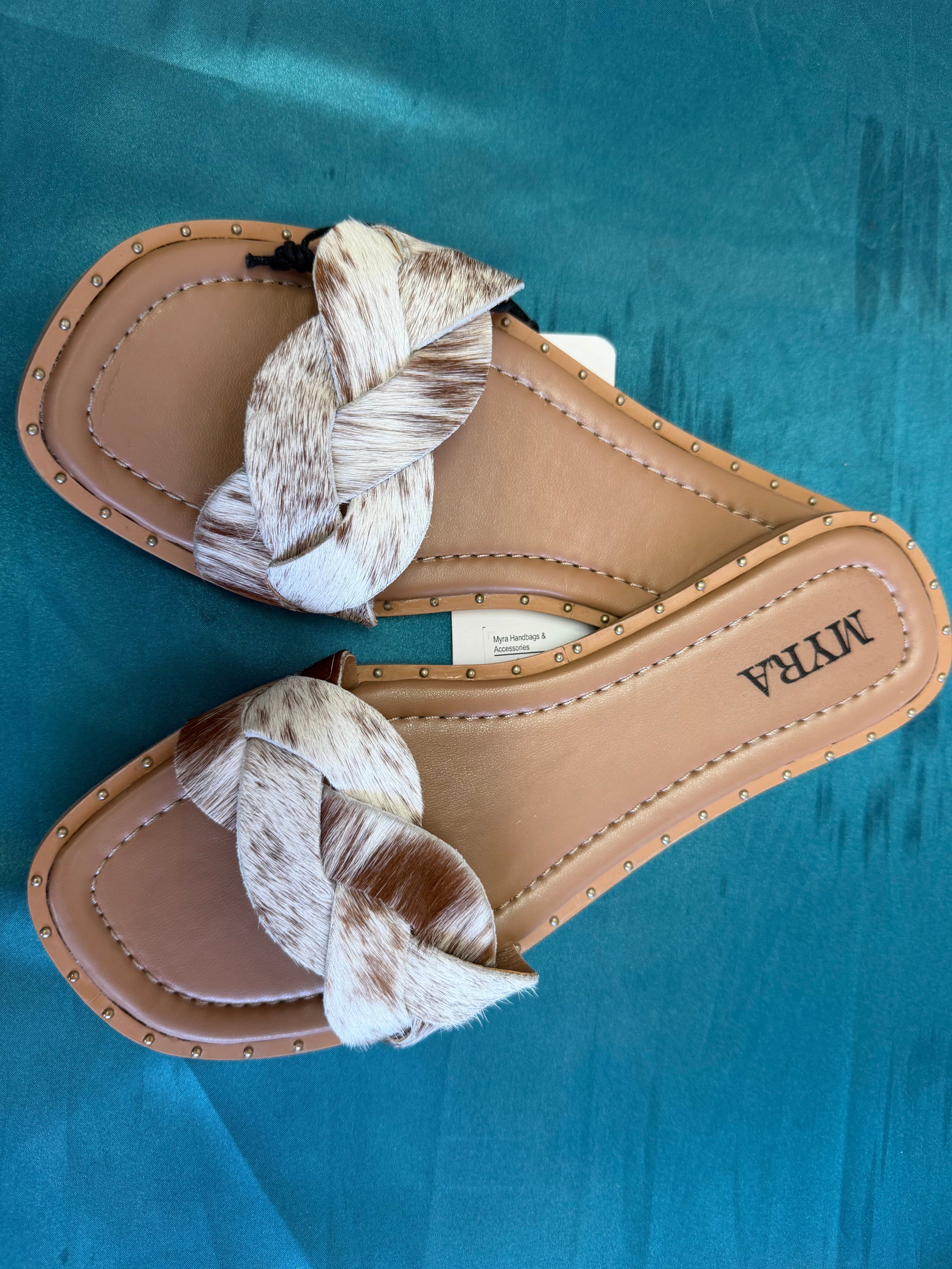 Step into summer with these gorgeous cowhide sandals! 🤎✨